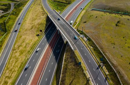 Aerial drone view of motion blurred traffic on a new, dual carriageway road constructionの写真素材
