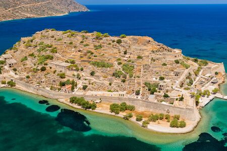 Aerial drone view of the ruins of the fortress and leper colony on Spinalonga island, Crete Greeceの写真素材