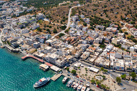 ELOUNDA, CRETE, GREECE - JULY 16 2019: Aerial view of the popular high-end tourist town of Elounda on the Greek island of Crete in the Aegean Sea.のeditorial素材
