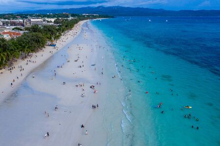 BORACAY, PHILIPPINES - 18 JUNE 2019: Crowds gathering on Boracay Island's White Beach to watch the sunset.  Boracay Island was closed and recently reopened to tourists by the Philippine Government.の写真素材