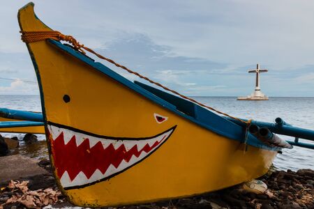 Small wooden boats on a tropical beach in the Philippinesの写真素材