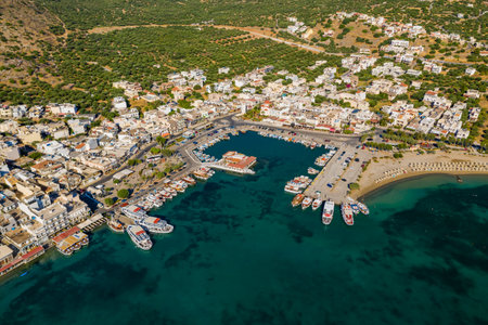 ELOUNDA, CRETE, GREECE - 13 JULY 2019: Aerial view of the up market town of Elounda on the greek island of Creteのeditorial素材