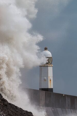 Large ocean waves and breaking waves on the Welsh coastline (Porthcawl, Wales)の写真素材