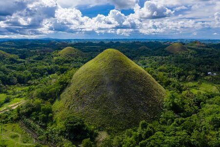 Aerial drone view of the unique scenery of the Chocolate Hills landscape in Bohol, Philippinesの写真素材