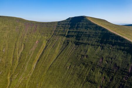 Aerial drone view of the twin peaks of mountains Corn Du and Pen-y-Fan in the Brecon Beacons of Wales, UKの写真素材