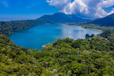 Aerial view of a beautiful lake inside an old volcanic caldera (Lake Buyan, Twin Lakes, Bali, Indonesia)の写真素材