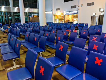 SURAT THANI, THAILAND - JUNE 05 2020: Rows of empty seats with social distancing closures in the departure lounge of Surat Thani International Airport. Thailand has resumed domestic flights with social-distancing measures following the Coronavirus worldwiのeditorial素材