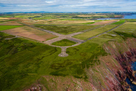 Aerial view of runways on a closed, overgrown WW2 airfield