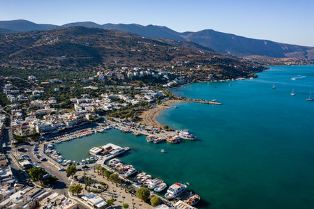 ELOUNDA, CRETE, GREECE - 22 AUGUST 2020: Aerial view of the popular Greek town and port of Elounda on the island of Creteのeditorial素材