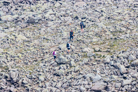 SCAFELL PIKE, ENGLAND - AUGUST 11 2020: Hikers on a ridge near the summit of Scafell Pike in England's Lake District.  Scafell Pike is England's tallest peakのeditorial素材