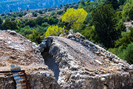 Remains of an old, earthquake split church near the deserted village of Metaxochori on the island of Crete, Greeceの写真素材