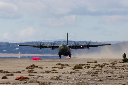 PEMBREY, WALES - APRIL 13 2021: A Royal Air Force Lockheed C-130J 'Super Hercules' performing...