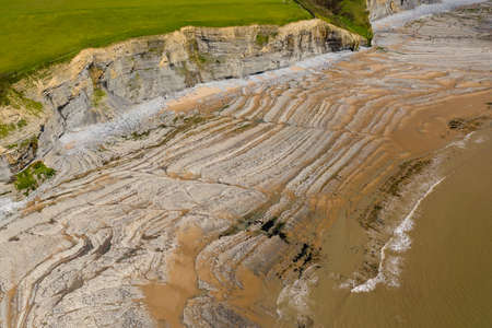 Aerial view of spectacular coastal limestone cliffs and ocean at Southerndown, Wales. UKの写真素材