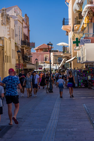 CHANIA, CRETE - JULY 22 2021: Crowds of tourists in the narrow streets of Chania old town on the Greek island of Crete. Despite the Coronavirus pandemic the city remains relatively busy.のeditorial素材