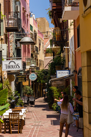 CHANIA, CRETE - JULY 22 2021: Crowds of tourists in the narrow streets of Chania old town on the Greek island of Crete. Despite the Coronavirus pandemic the city remains relatively busy.のeditorial素材