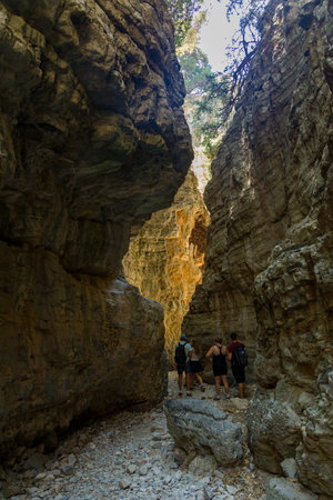 IMBROS GORGE, CRETE - 23 JULY 2021: Hikers exploring the narrow canyons and terrain of the Imbros Gorge in central Crete, Greeceのeditorial素材