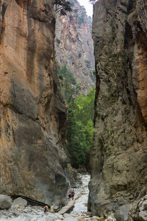 SAMARIA GORGE, CRETE - 20 JULY 2021: Hikers in the spectacular mountain and forest scenery of the Samaria Gorge on the Greek island of Creteのeditorial素材
