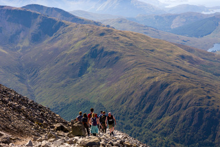BEN NEVIS, SCOTLAND - SEPTEMBER 01 2021: Hikers making their way up the main track towards the summit of Ben Nevis on a hot, clear, summer's dayのeditorial素材