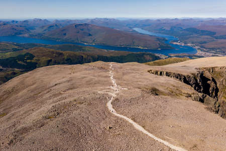Aerial view of the footpath to the summit of Ben Nevis with several sea Lochs in the background.