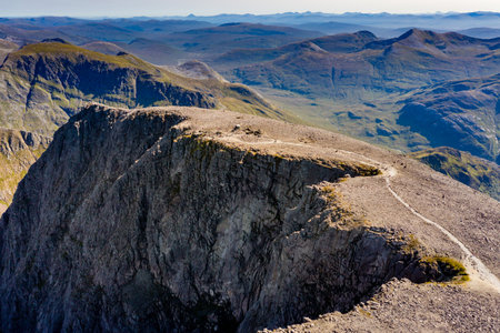 Aerial view of the summit of Ben Nevis - Scotland and the UK's tallest mountain on a clear, sunny dayの写真素材