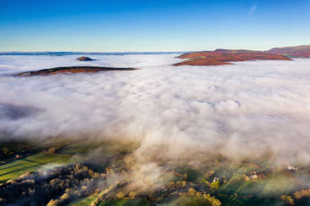 Aerial view of low level fog and cloud in a valley in the rural Brecon Beacons, Wales, UKの写真素材