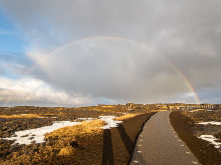 Rainbow spanning the gap between the North American and Eurasian continental plates in western Icelandの写真素材