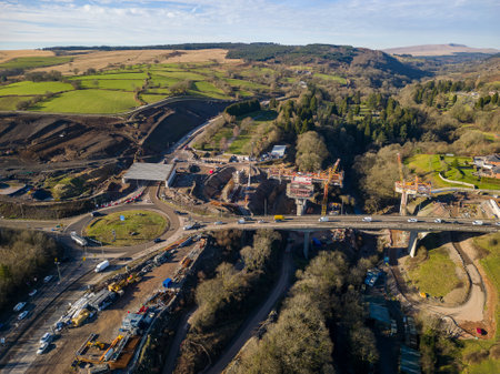 MERTHYR TYDFIL, WALES - FEBRUARY 06 2023: Aerial view of a roundabout and major roadworks at section 5 of the A465 "Heads of the Valleys" road in South Wales, UKのeditorial素材