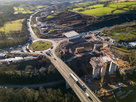 MERTHYR TYDFIL, WALES - FEBRUARY 06 2023: Aerial view of a roundabout and major roadworks at section 5 of the A465 "Heads of the Valleys" road in South Wales, UKのeditorial素材