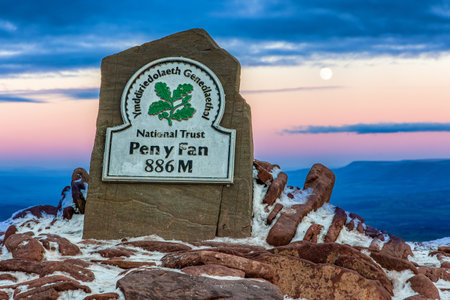 PEN-Y-FAN, WALES - DECEMBER 12 2022: Image of the summit of Pen-y-Fan in the Brecon Beacons at sunset. Pen-y-Fan is the tallest peak in the mountain range at 886m.のeditorial素材