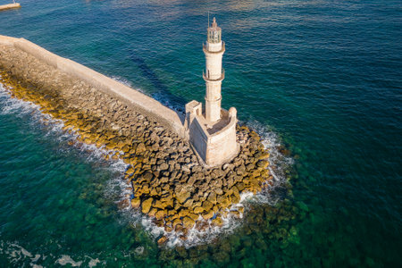 Aerial view of a lighthouse and the old Venetian harbor in the Greek town of Chania on the island of...