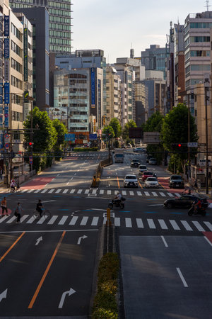 TOKYO, JAPAN - JULY 16 2023: Near deserted streets and roads in central Tokyo as the population...
