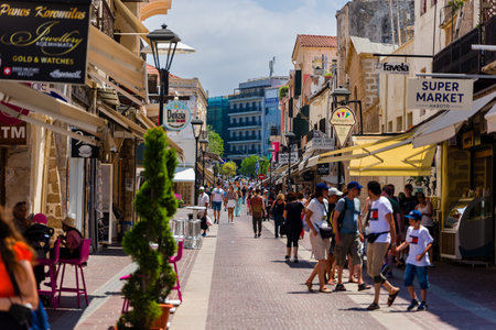 CRETE, GREECE - JULY 03 2023: Crowds of tourists in the old, narrow streets of Chania in western Crete, Greece.のeditorial素材