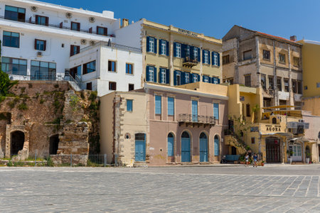 CRETE, GREECE - JULY 03 2023: The empty square of Chania old Venetian harbour on a hot summers day.のeditorial素材