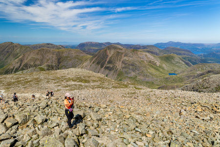 WASDALE, ENGLAND - AUGUST 13 2023 - Hikers on the summit of Scafell Pike, England's tallest mountain on a hot summers dayのeditorial素材