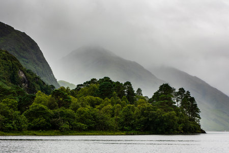 Stormy weather and rain on the shores of a Scottish Loch (Loch Shiel, Highlands)の写真素材