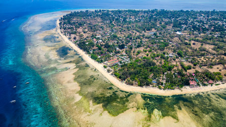 Aerial view of the fringing coral reef surrounding the small island of Gili Air in Lombok, Indonesiaの写真素材
