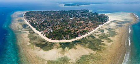 Aerial view of the coral reef surrounding the tiny Indonesian island of Gili Airの写真素材