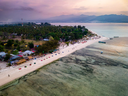 Aerial view of a beach resort on a small tropical island at sunset (Gili Air, Indonesia)の写真素材