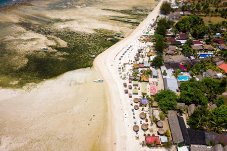 Aerial view of small tourist resorts and sunshades on a tropical island (Gili Air, Lombok, Indonesia)の写真素材
