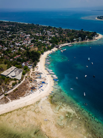 Aerial view of a port and coral reef on the coast of a small tropical island in Indonesia (Gili Islands, Lombok)の写真素材