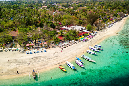 Aerial view of the upper reef flat of a fringing coral reef on a small tropical islandの写真素材