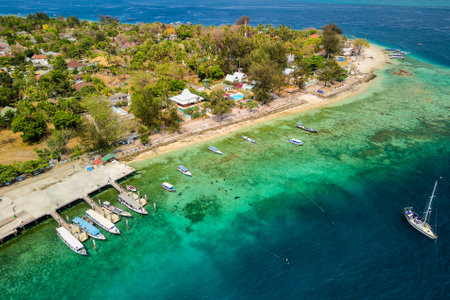 Aerial view of a busy tourist port area on a small tropical island (Gili Air, Lombok, Indonesia)の写真素材