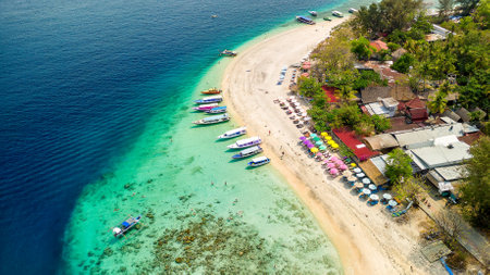Aerial view of the upper reef flat of a fringing coral reef on a small tropical islandの写真素材