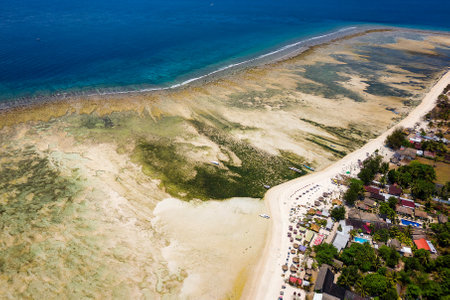 Aerial view of a large reef flat (table) of a fringing coral reef in Indonesiaの写真素材
