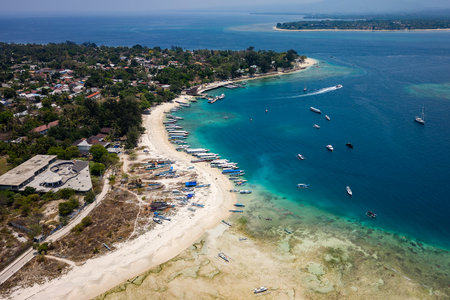 Aerial view of a busy tourist port area on a small tropical island (Gili Air, Lombok, Indonesia)の写真素材