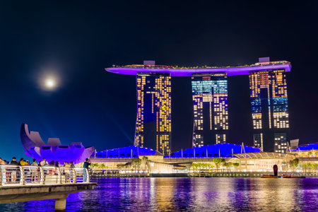 SINGAPORE - APRIL 06 2023: Night illuminations around the Marina Bay area of the city of Singaporeのeditorial素材