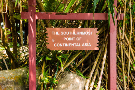 SINGAPORE - APRIL 08 2024: A sign marking the southernmost point of continental Asia on Sentosa island, Singaporeのeditorial素材