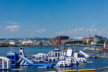 CARDIFF,WALES - JULY 29 2024: A floating childrens' summer entertainment aqua park in Cardiff Bay, Walesのeditorial素材