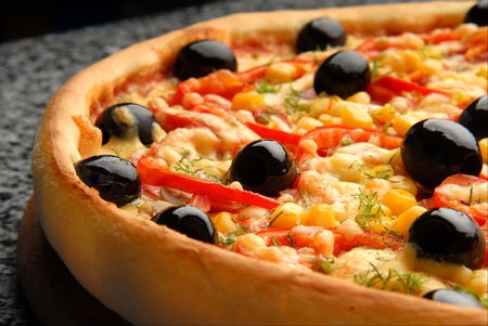 Round Italian pizza with salami, capsicum and olives siromの写真素材