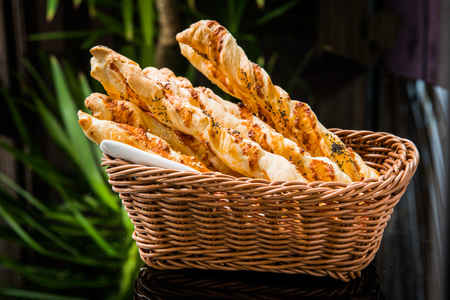 Crispy bread sticks on old wooden table.